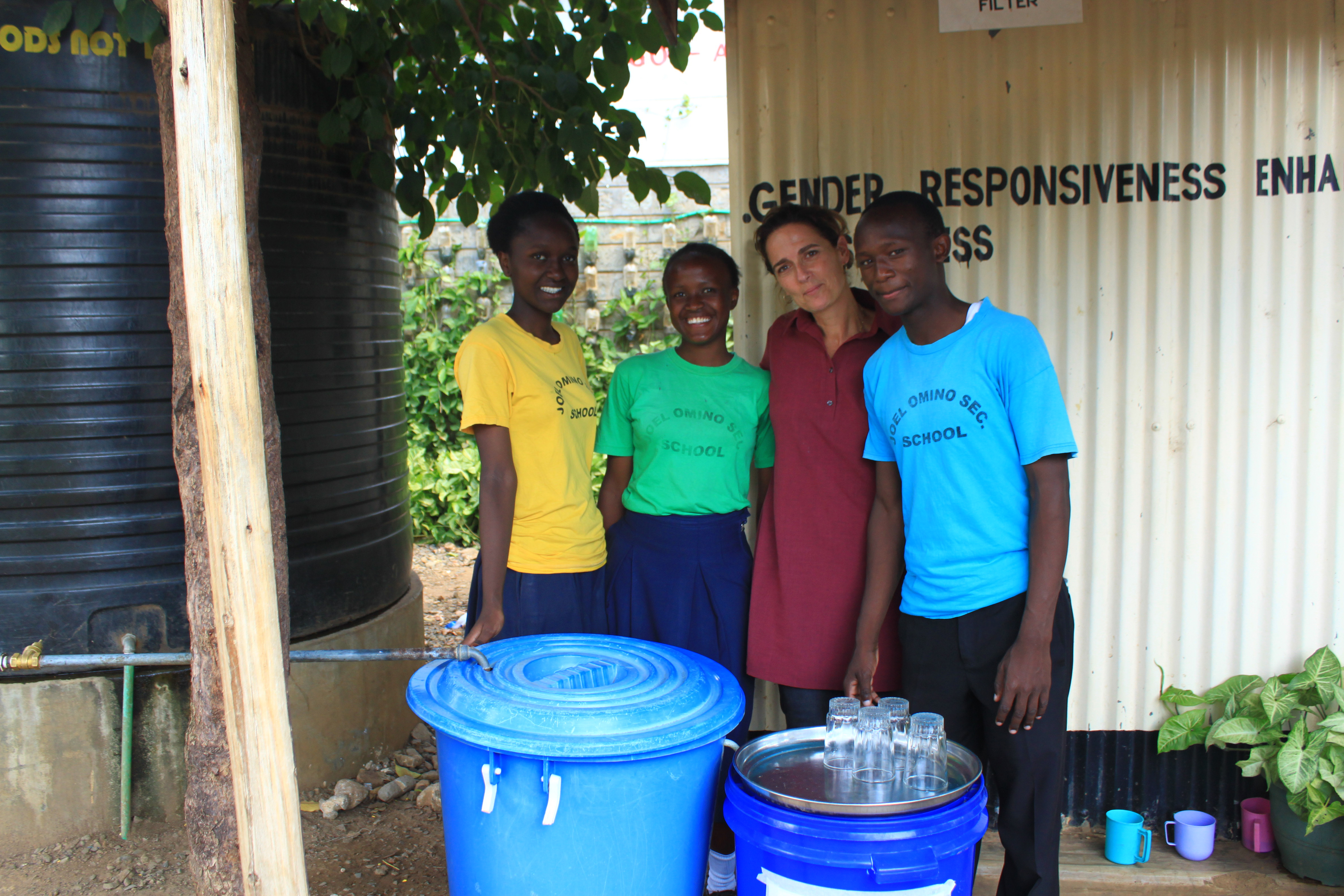 Image 1 - Michal with students, by a bio-sand filtration system set up in their school by Joel Omino in Kisumu, Kenya.
