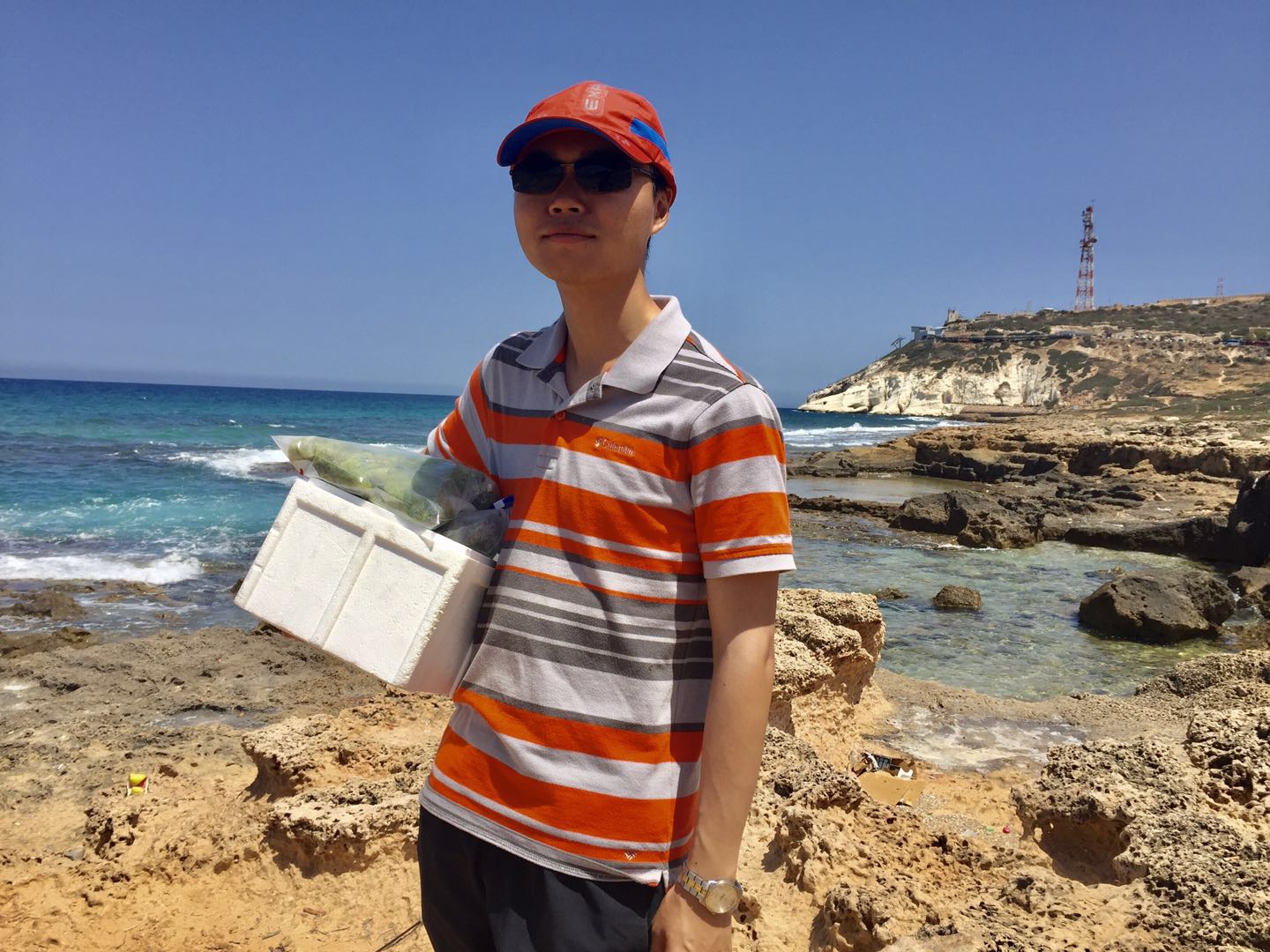 Image:  Jincheng Luo during algae research, at Rosh Hanikra, Israel